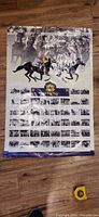 Full view of Queen’s Plate winners poster with tape measure for scale