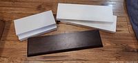 Five floating shelves laid out showing color and sizes