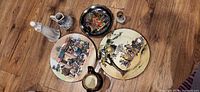 Group shot of three plates, pitcher, two mini jugs, figurine