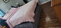 Comforter spread on queen bed showing pastel faux fur top