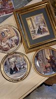 Group shot of three plates and framed print