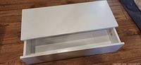 Shelf top and open drawer showing interior