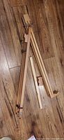 Easel folded showing tripod legs and hardware