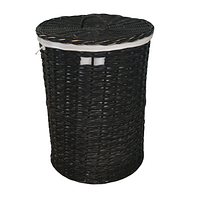 Large round black wicker laundry basket with lid closed, showing woven texture and top handle.