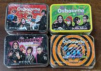 Four sealed Osbourne Party bubble gum tins with different designs.
