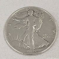 Obverse side showing the Walking Liberty design and date 1945.