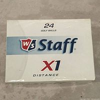 Closed box with label showing Wilson Staff X1 Distance golf balls, quantity 24