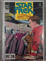 Star Trek Comic Book Issue #11 cover showing James T. Kirk at trial, courtroom scene, colorful comic art.