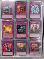 Photo of Magic The Gathering trap cards in a binder sleeve, showing cards such as Kamakiri Cash Shed, Job Guard, Roadblock Search, Kozmourning, Liberty at Last!, The Absorbing Machine.