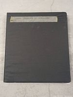 Closed black binder with a label on front reading 'Darkness Landswap An Introduction'