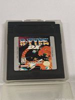 Front view of R-Type DX Nintendo Game Boy Color cartridge showing game label and color artwork.