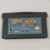 Front side of the Game Boy Advance cartridge showing Sonic Advance and Sonic Pinball Party titles with official Nintendo and SEGA logos