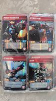 Plastic sleeve showing four Transformers collectible cards including Private Trailbreaker, Optimus Prime (two cards), Bluestreak, and Jetfire characters with stats and artwork.