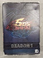 Front cover of the main box sleeve for YU-GI-OH! 5Ds Season 1 DVD set showing wear on edges and corners