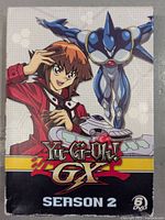 Front cover of the Yu-Gi-Oh! GX Season 2 DVD boxset showing main characters and series title with 6 DVD label.