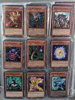 Page with nine Yu-Gi-Oh! monster cards including Traptrix Lightworm Moth, D. Claw Scorpion, and Electric Virus.