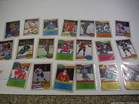 20 vintage 1980 O-Pee-Chee NHL hockey cards from various teams laid out on a surface showing front side images of players, team logos, and card details.