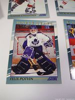 Close-up photo of a Felix Potvin hockey card from the 1992 Score Young Superstars series, showing the player in full goalie gear with Maple Leafs logo.