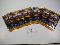 Six sealed packs of 2024 Score-A-Treat NFL trading cards with carved pumpkin packaging, arranged in a row with lot number 38 shown.