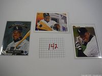 Lot of three Frank Thomas baseball cards showing various poses in Chicago White Sox uniform.