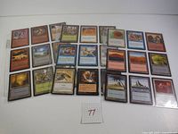 Magic: The Gathering cards organized in a protective sleeve page, showing multiple cards from different colors and types