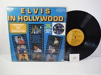 Front of the vinyl album cover with various images of Elvis and the album title.