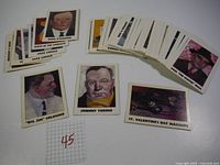 Overview of approx. 76 glossy collectible cards fanned and stacked, showing various illustrated crime figures and events, including Johnny Torrio and Big Jim Colosimo.