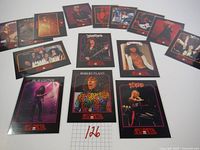 Full view of all 15 Mega Metal vintage rock collectible cards laid out flat showing images of the bands and artists including Judas Priest, Skid Row, Robert Plant, Dio, Bon Jovi, and Slaughter.