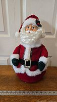 Front view of vintage Pan Asian animated Santa Claus figure approximately 17 inches tall, showing facial details, red velvet suit, and white fur trim.