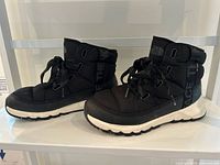 Side profile of both boots showing overall condition and shape