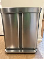 Front full view of SimpleHuman dual compartment stainless steel garbage and recycling bin