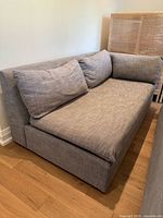 Right-facing sofa section showing seat cushion, back cushions and armless design