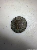 Photo of the reverse side of the 1893 Canadian penny showing the large ONE CENT inscription within a wreath.