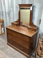 Front-right angle showing dresser with mirror and small drawers, highlighting condition and structure
