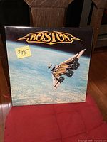 Front cover of Boston's Third Stage album with spaceship guitar artwork and logo.