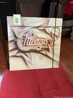 Front cover of Chicago 17 vinyl album showing embossed wax seal style logo and string design.