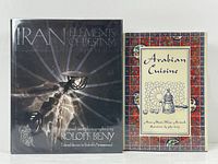 Front covers of the two books: 'Iran Elements of Destiny' and 'Arabian Cuisine'