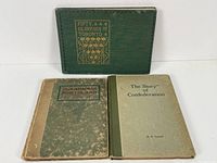 Three hardcover vintage books displayed upright: '50 Glimpses of Toronto' with decorative green cover, 'The Canadian Northland' worn green and beige cover, and 'The Story of the Confederation' plain olive green cover.
