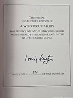 Photo of the title page displaying the author's signature and the limited edition number 12 of 100.