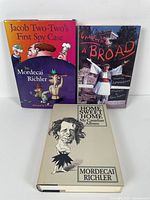 Three books displayed: 'Jacob Two-Two's First Spy Case,' 'Charlie a Broad,' and 'Home Sweet Home: My Canadian Album.'