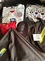 Group shot showing jersey, visor, pads packages and Weaver Arborist bag