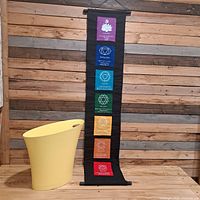 full view of banner and waste basket on wooden surface