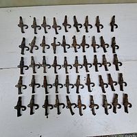 Full grid view of all rusted maple syrup spiles