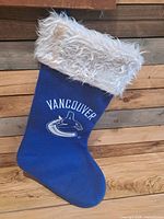 Full view of blue Vancouver Canucks stocking with white faux fur cuff