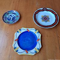 Three plates laid out showing size and design variety