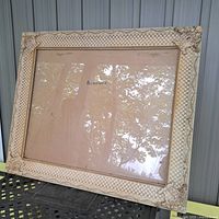 Full view of large ornate cream picture frame