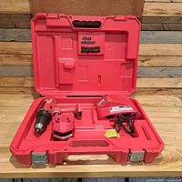 Open carry case showing drill, battery, charger