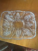 Full view of glass platter showing overall shape and iris design