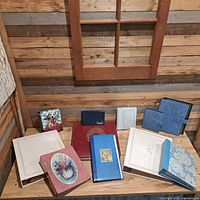 Group shot of nine albums showing variety of covers and sizes