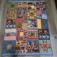 Full view of entire quilt laid out on floor